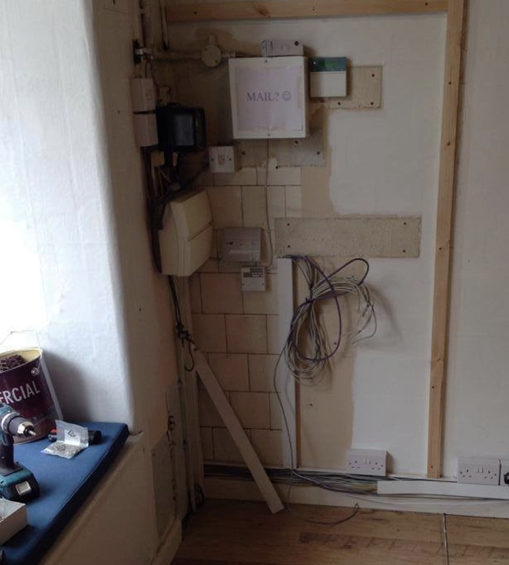 Electrical meter box in an Edinburgh shop before picture